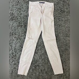 Baby pink skinny jeans